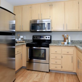 Spacious kitchens with thoughtful details a kitchen with wooden cabinets
