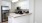 a kitchen with serving counter