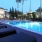 lounge chairs next to swimming pool