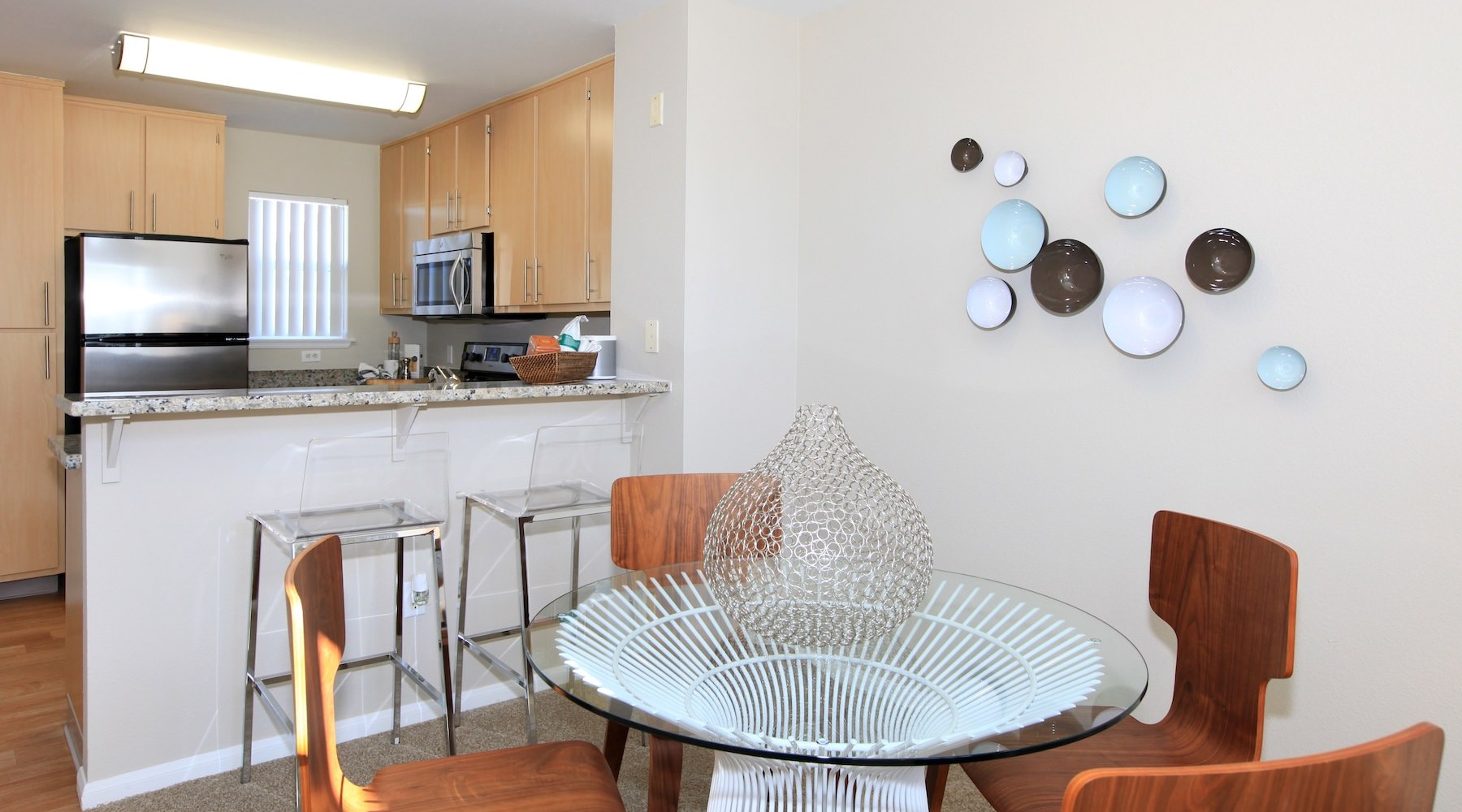 a dining room with a table and chairs