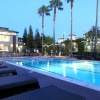 a pool with a building in the background