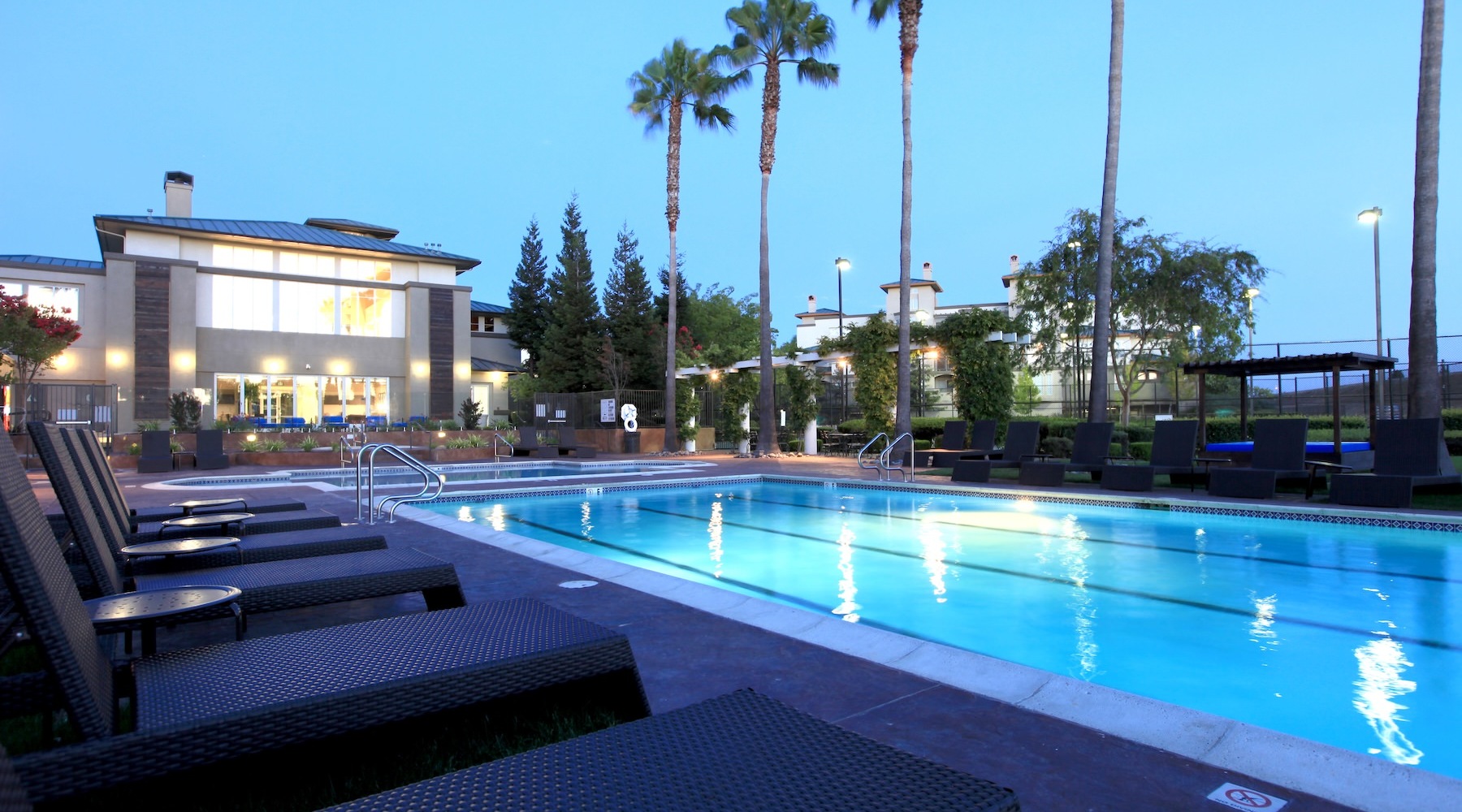 a pool with a building in the background