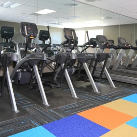 Quick access to state-of-the-art amenities a gym with exercise equipment